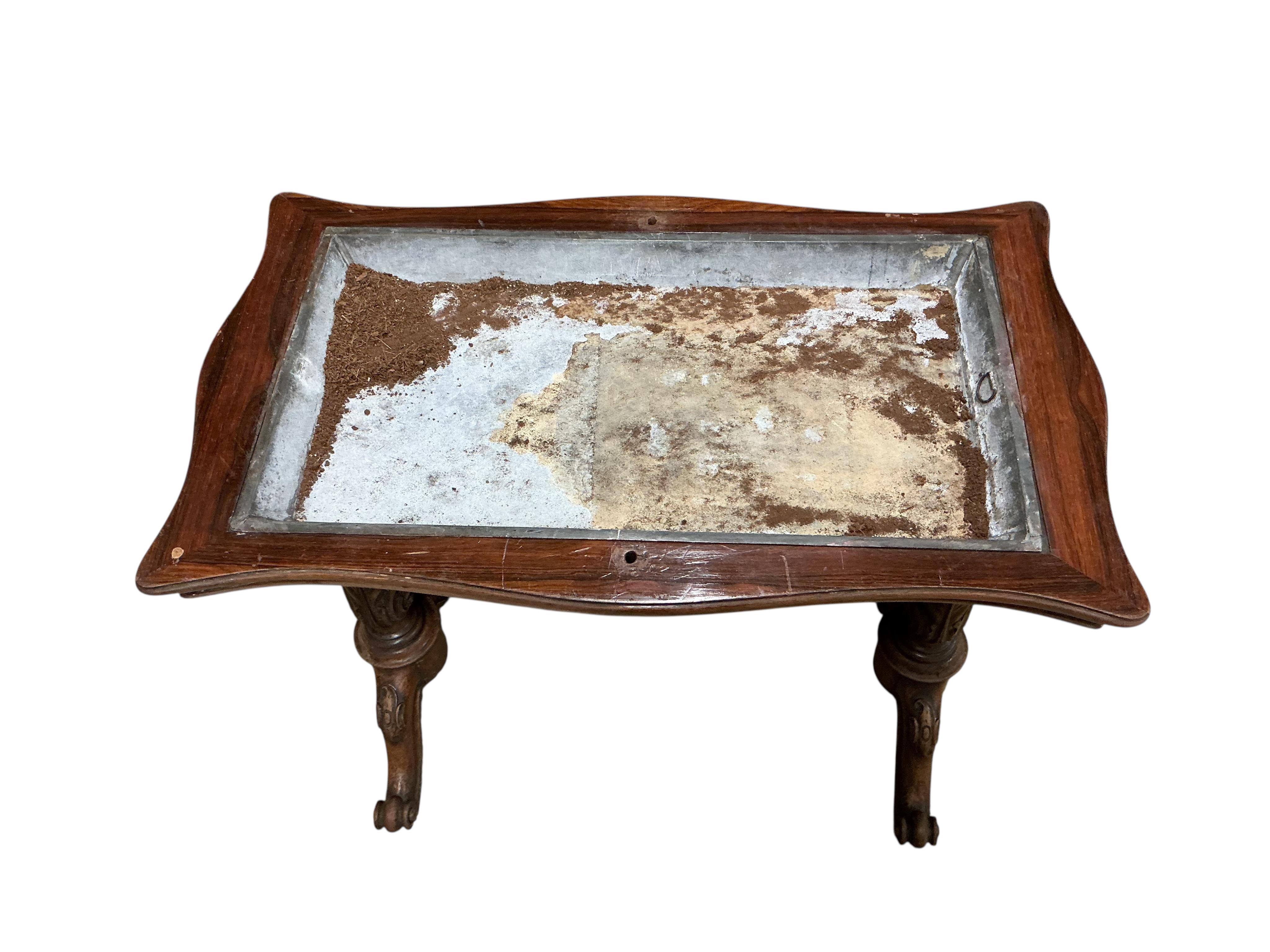 An early Victorian rosewood serpentine folding writing, jardiniere table, width 80cm, depth 49cm, height 71cm